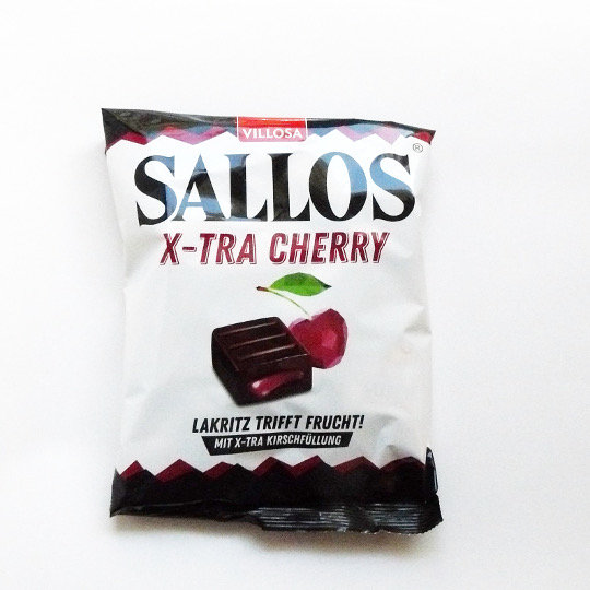 Bag with liquorice candies filled with cherry, german