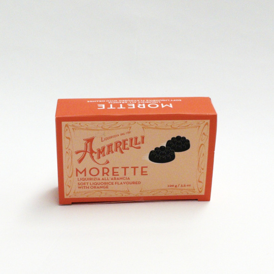 Sweet bitter liquorice with natural flavour of orange in a box, italian